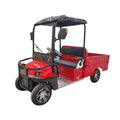 ocean cartz three-quarter front studio shot of a red utility electric vehicle with a short flatbed, set against a pure white background. This two-seater electric work cart features a black roof, black seats, a robust black front brush guard, and a small windshield with a wiper. The electric utility truck has custom silver alloy wheels and is designed for commercial hauling and property maintenance tasks.