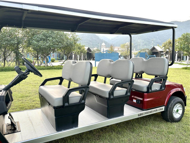 Golf cart with multiple seats on a grassy area