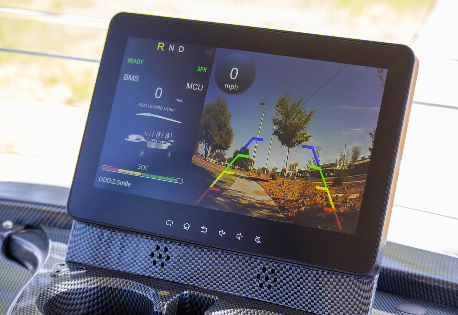 Digital display showing vehicle information with a road map in the background