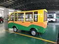 Small green and yellow vehicle in a warehouse setting