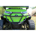 Green ATV with a black front bumper on a grassy area