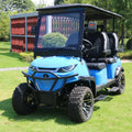 Blue golf cart on a grassy area with a red building in the background