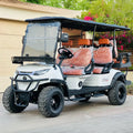 White golf cart with orange seats on a wooden deck