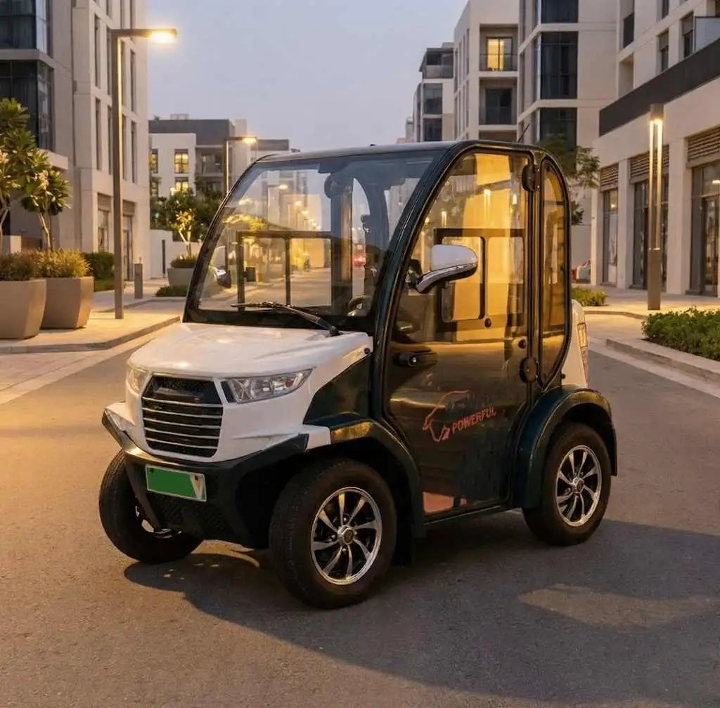 White and black electric vehicle with a transparent canopy, featuring silver alloy wheels.